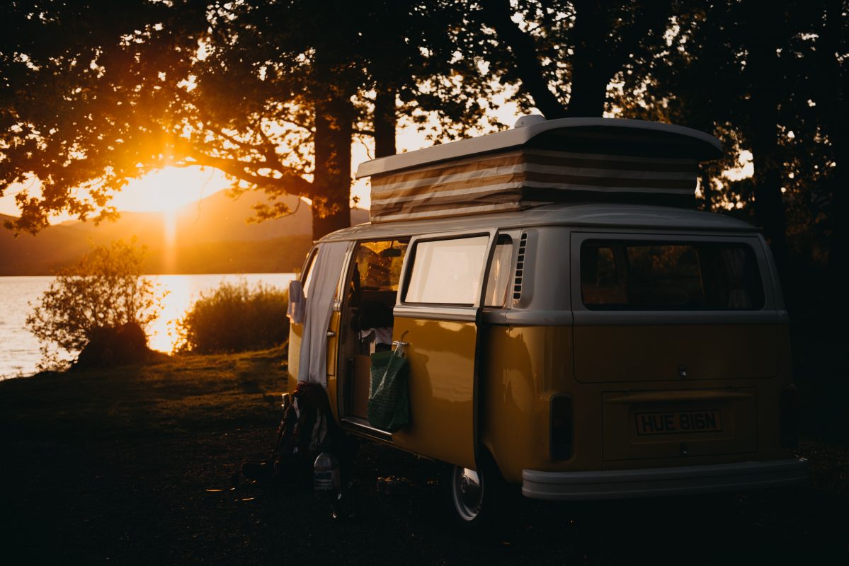 pop top campervan with sunset in the backgroun