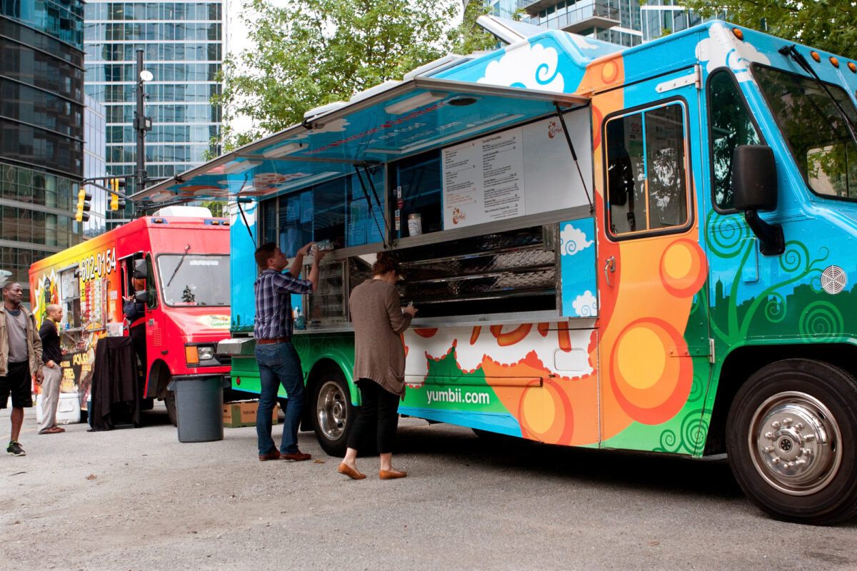 Catering van serving food to customers